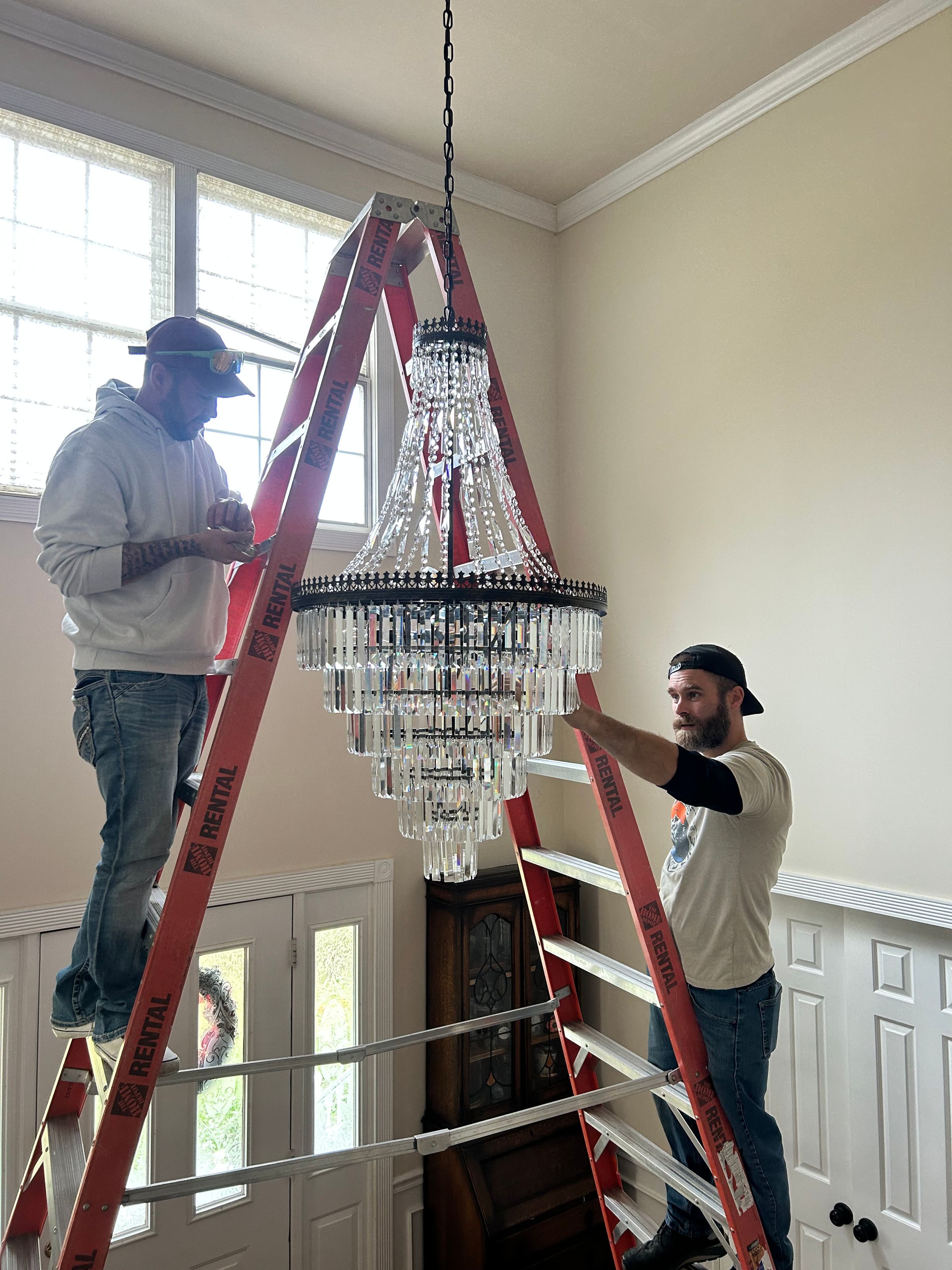 Josh and worker, working on Lighting